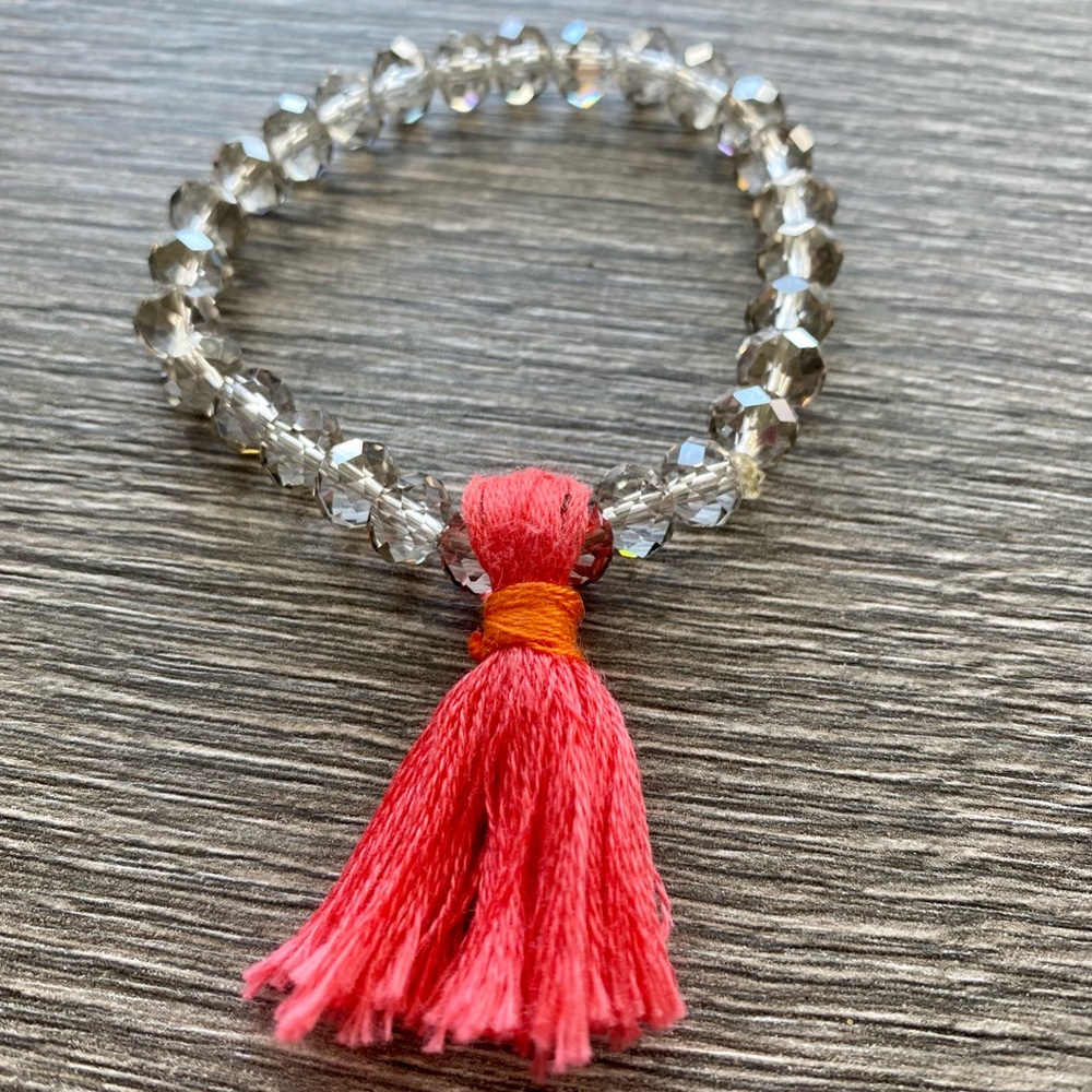 Boho bracelet with tangerine and melon tassel.  One size